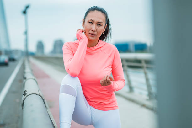 istock Asian woman working out 1180065928