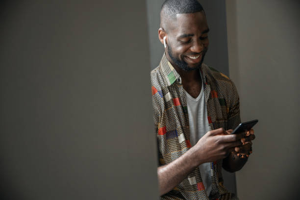 istock Young African Man Use Smart Phone 1180066047