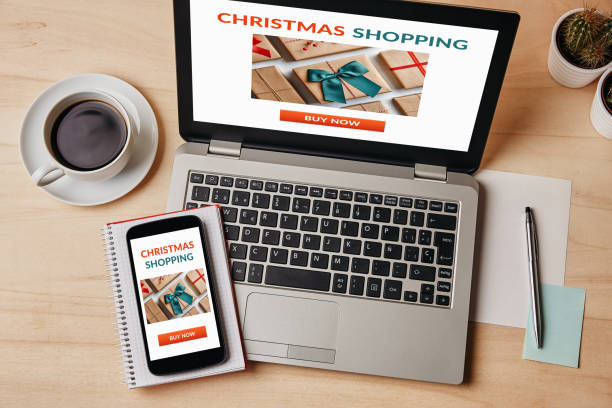 istock Christmas shopping concept on laptop and smartphone screen 1180068282