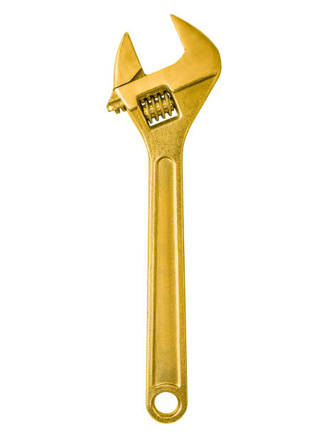 Golden adjustable wrench isolated on white background.