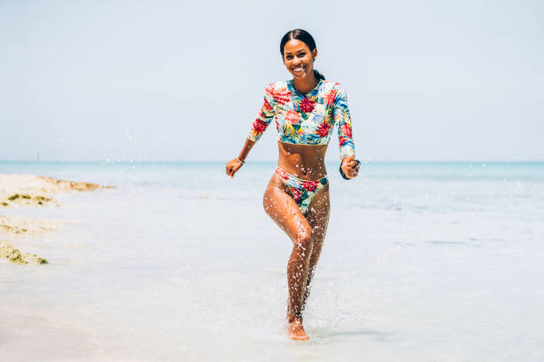 istock Young Black woman at tropical beach 1180070919