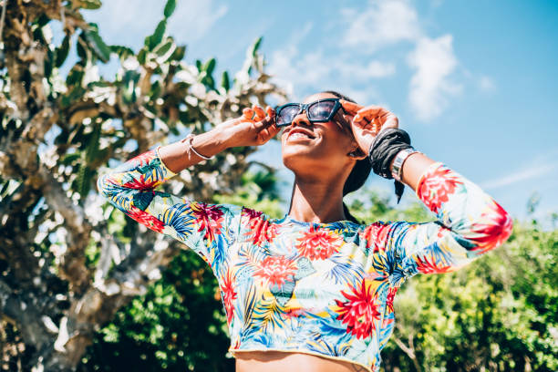 istock Young Black woman at resort cabana 1180071148