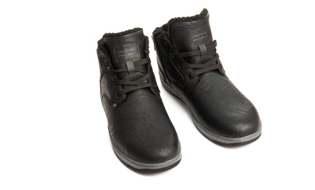 istock warm men's shoes isolated 1180071307