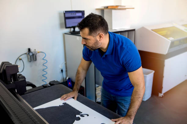 istock Hispanic mature man working in printing office 1180071493