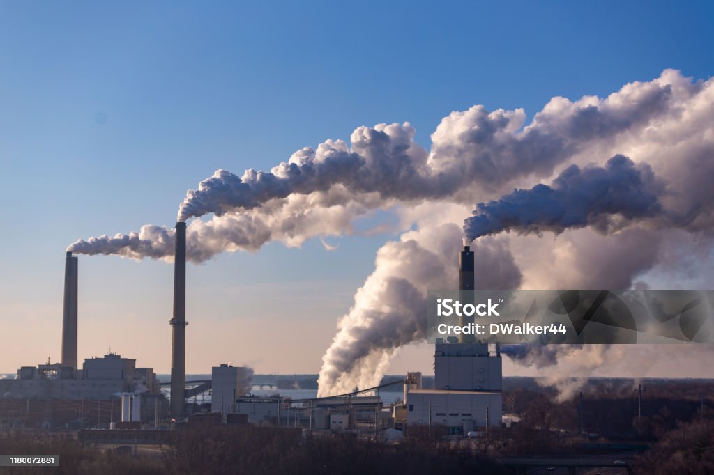 Wind Blowing Pollution Wind is blowing pollution from a coal burning power plant. Pollution Stock Photo