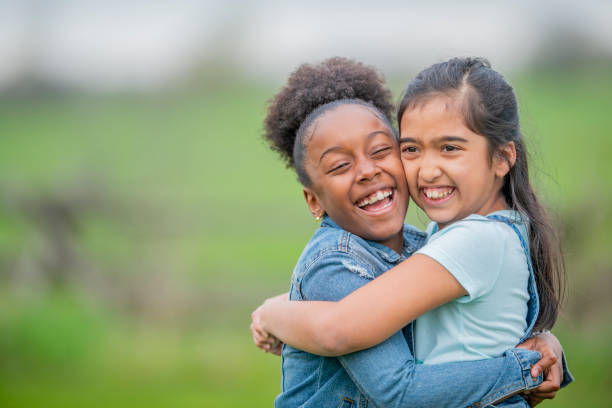 istock Multi-Ethnic Children Hugging stock photo 1180073592