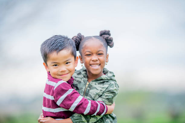 istock Multi-Ethnic Little Friends Hugging stock photo 1180073609