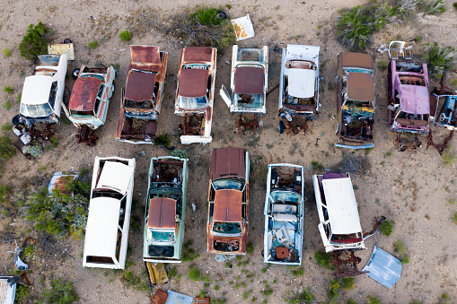 Wrecked, rusty, vintage American classic cars, aerial view, Arizona, USA.