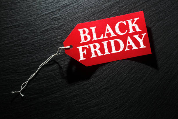 istock Black Friday Sale tag on dark background 1180074172