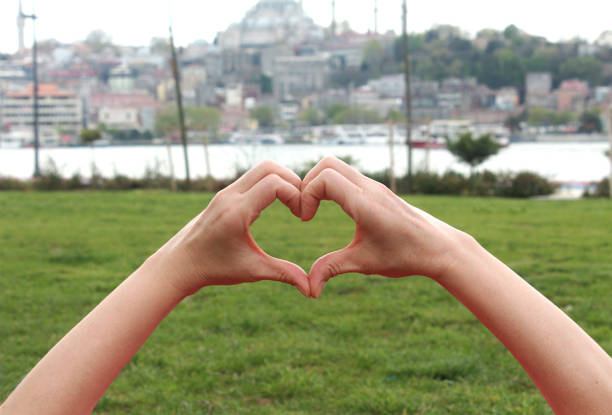istock Woman heart hands 1180074951