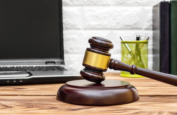 istock Judge's gavel on the office desk near wall. 1180075268