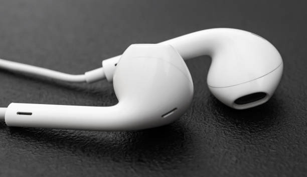 istock Small headphones on black background. Close up. 1180075554