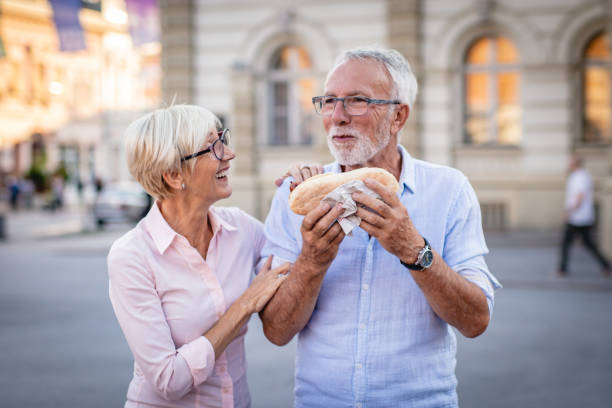 istock Senior couple eating fast food 1180075626