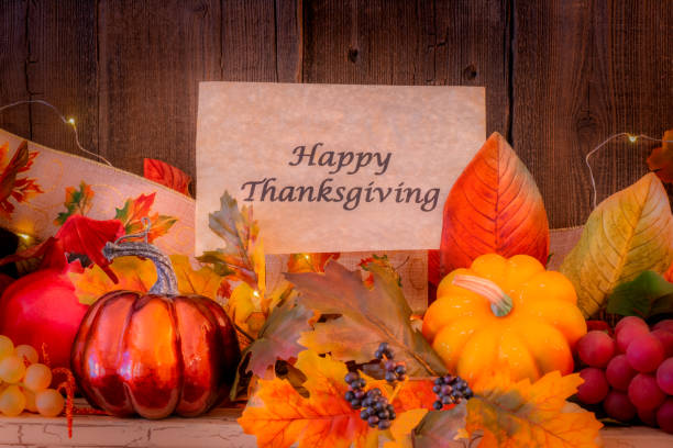 istock Cozy fireplace mantelpiece with Thanksgiving sign  and grapes (P) 1180076307