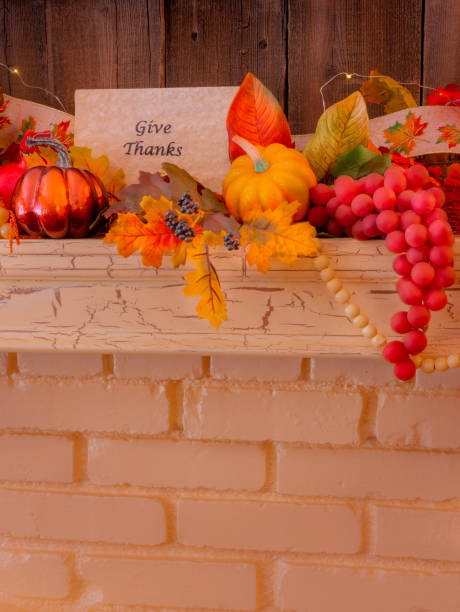 istock Cozy fireplace mantelpiece with Thanksgiving sign  and grapes (P) 1180076321
