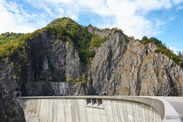 istock Hydropower construction, waterworks Dam Vidrau on Transfagarash highway in Romania. Dam and reservoir on Lake Vidraru. 1180076533