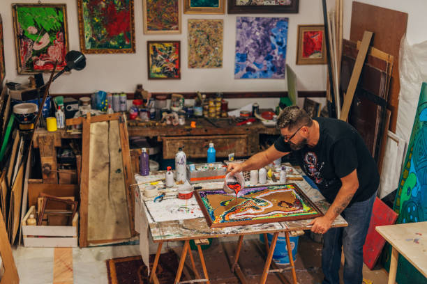 istock Male artist in his studio 1180077719