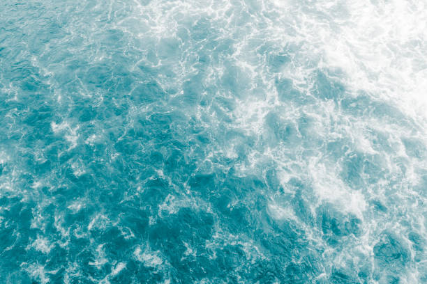 istock Pale green gentle breeze sea surface with waves 1180077802