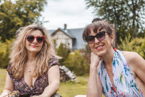 istock portrait of two mature friendly women 1180079430