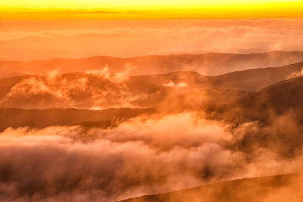 istock Splendid mountain sunrise. Mountains silhouettes on a beauty background. 1180079991