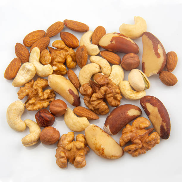 istock different nuts on a white background. protein and healthy food 1180080523