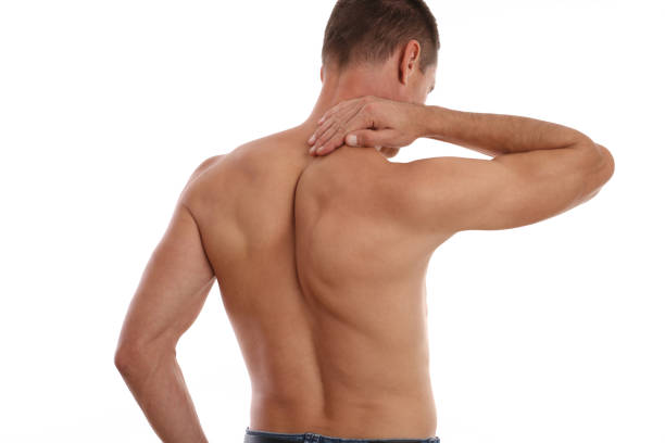 istock Man suffering from back and neck pain. Incorrect posture problems, Muscle spasm, .Pain relief, Chiropractic concept. Sport exercising injury 1180082064