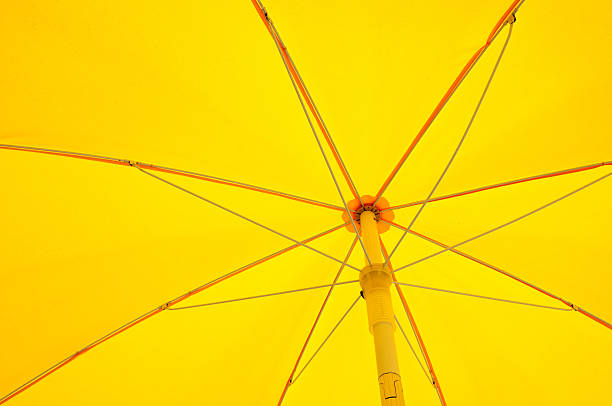 Inside of opened yellow umbrella stock photo
