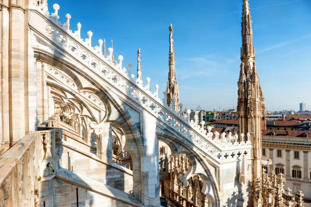 istock White statue on top of Duomo cathedral 1180083891