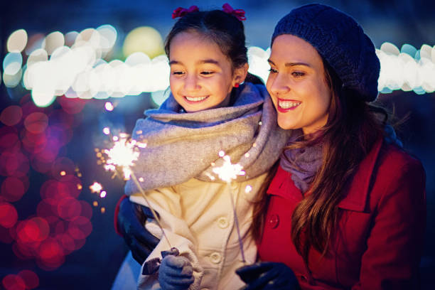 istock Mother is hugging her daughter at Christmas 1180083959