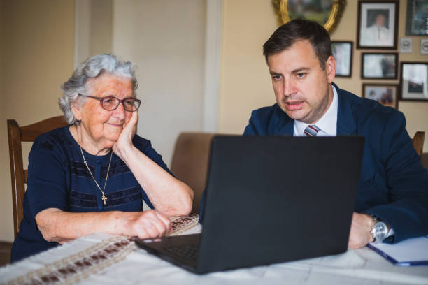 istock Senior woman making a contract with a lawyer 1180085985