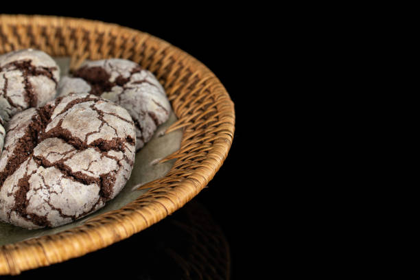 istock Chocolate brownie cookie isolated on black glass 1180086263
