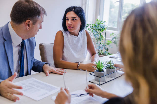 istock Man at office with business women 1180087279