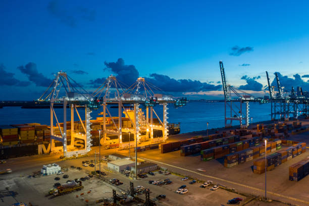 istock Port Miami loading MSC cargo ship at night shot with aerial drone 1180088016