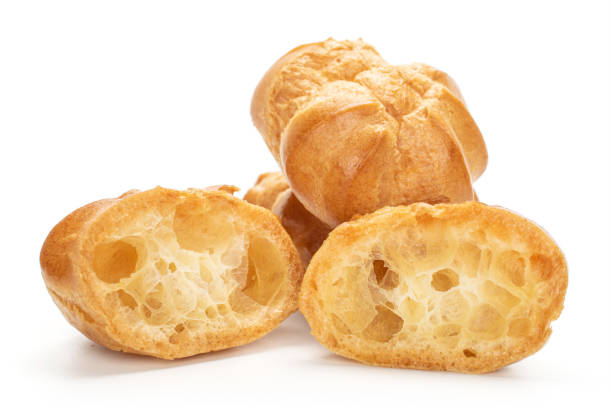 istock Golden baked profiterole isolated on white 1180091411