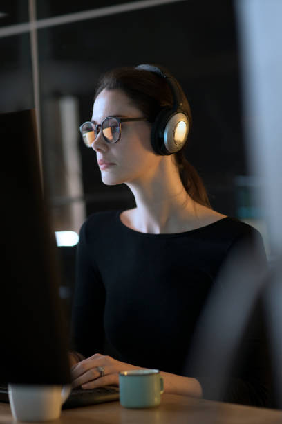 istock Computer headphones woman 1180097642