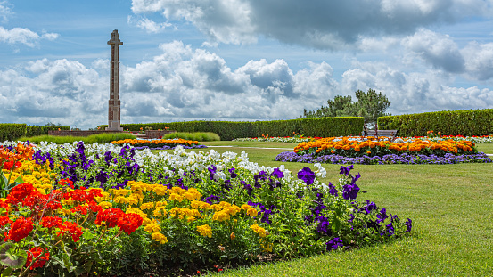 Colour landscape photograph of colourful flower displays installed within Poole park, Dorset, England.