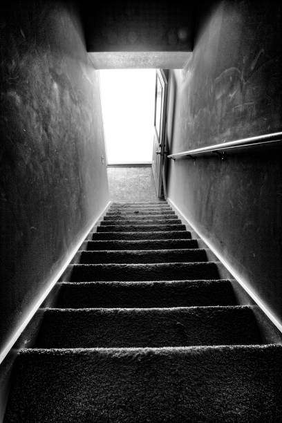 istock Stairway Down To The Light Black and White 