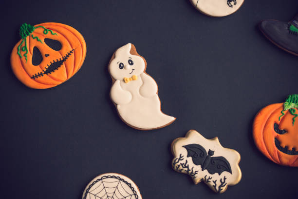 istock Halloween cookies on black background 1180105675