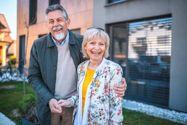 istock Relaxed Senior Couple Outside Vacation Residence 1180105757
