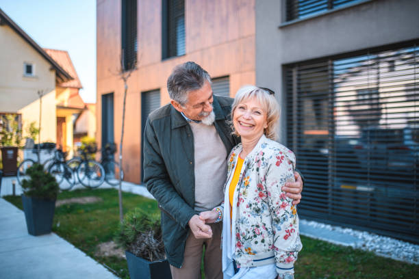 istock Relaxed Senior Couple Outside Vacation Residence 1180105763