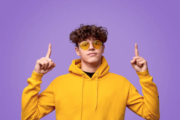 istock Funny teenager pointing up 1180106540