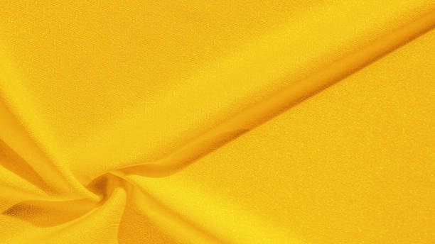 istock Texture, background, silk fabric, yellow woman's handkerchief; Design-friendly wallpaper design for your projects. 1180106742