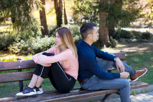 istock Romantic Couple on a Park Bench. 1180107088