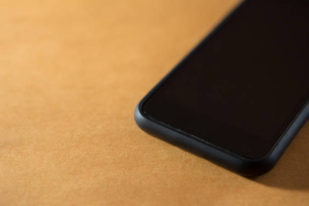 istock Selective focus of Smartphone on orange background and copy space 1180112319