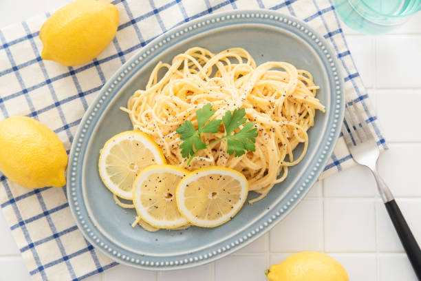 Cream pasta with a slice of lemon