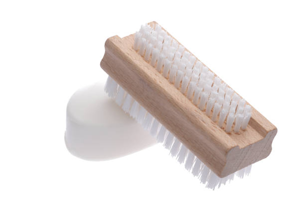 Nail brush and white pure soap isolated on white