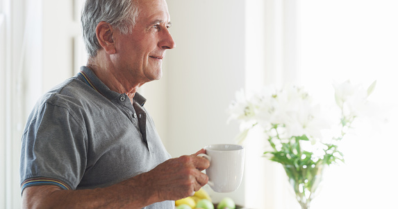 Shot of a senior man having a cup of coffee at home