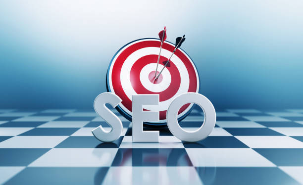 Red bulls eye target and SEO text standing on chess board. Horizontal composition with copy space. SEO concept.