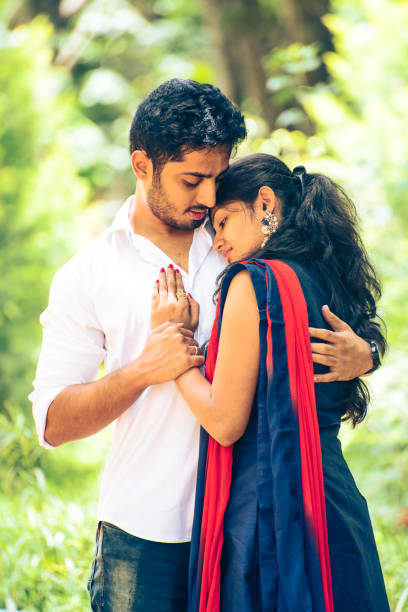 istock Happy Young Indian couple hugging 1180136649