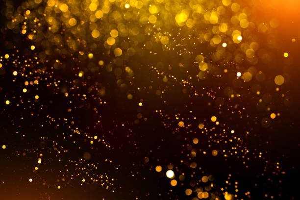 istock Golden abstract bokeh on black background. 1180139032
